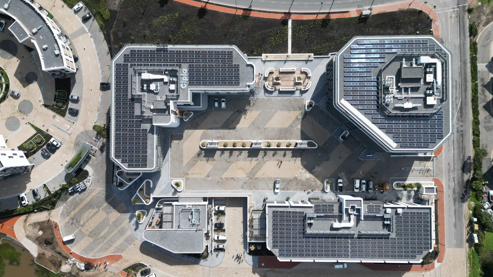 Junxion Park white building with solar panels